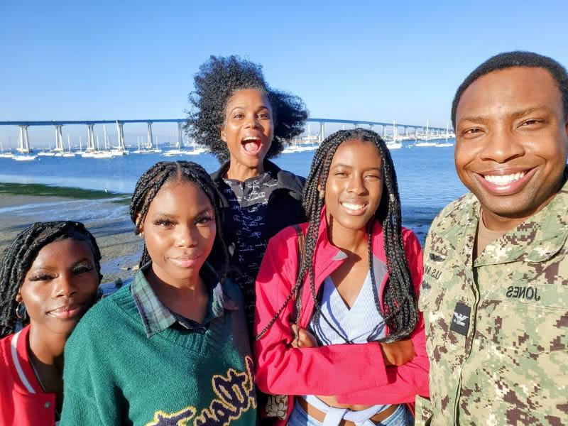 Sybil Jones (back center) and Marcus (far left) in San Diego with their three daughters. (Photo courtesy of Sybil Jones)